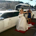 Wedding Limo Perth with the Bride exiting the Brand New 2013 White Chrysler 300C Vertical additional Bridal Door Stretch Wedding Limo in Perth City.